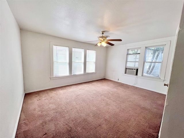 1801 6th St, Brownwood, TX 76801 - carpeted empty room featuring ceiling fan, cooling unit, and baseboards