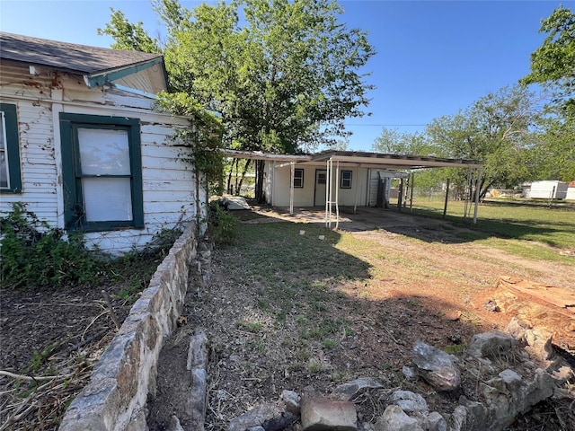 1801 6th St, Brownwood, TX 76801 - view of grassy yard with an attached carport