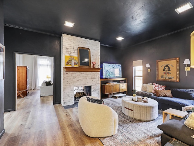 6512 Elkhurst Dr, Plano, TX 75023 - living area with plenty of natural light, wood finished floors, and a fireplace