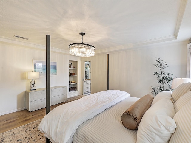6512 Elkhurst Dr, Plano, TX 75023 - bedroom featuring crown molding, wood finished floors, a chandelier, and baseboards