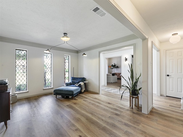 6512 Elkhurst Dr, Plano, TX 75023 - living area featuring light wood-type flooring, crown molding, and baseboards
