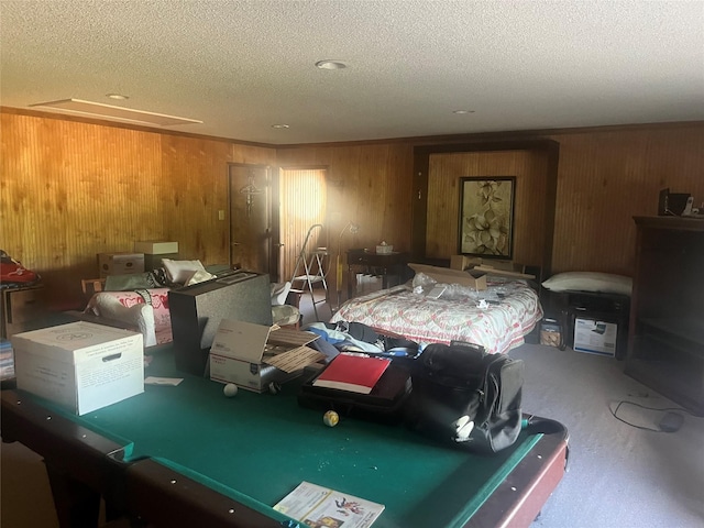1212 Oakwood Trl, Southlake, TX 76092 - carpeted bedroom featuring wooden walls, a textured ceiling, and billiards
