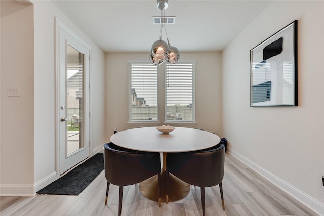 1308 Redbrick Ln, Northlake, TX 76247 - dining space with light wood-type flooring, a chandelier, and baseboards