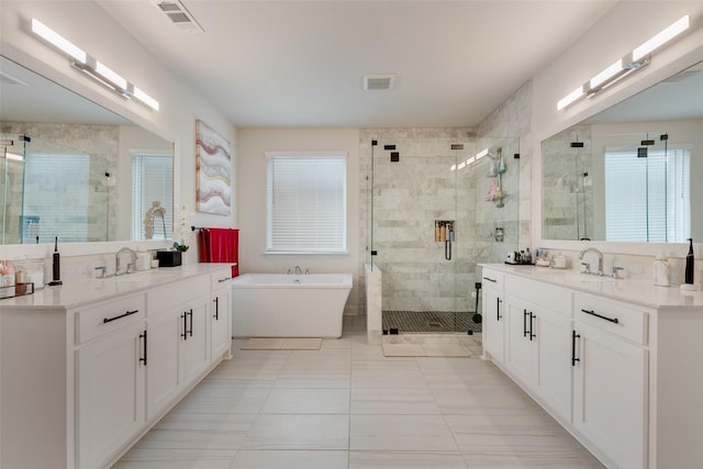 1308 Redbrick Ln, Northlake, TX 76247 - full bath featuring a shower stall, two vanities, a freestanding bath, and tile patterned floors