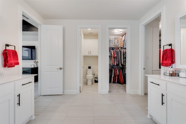 1308 Redbrick Ln, Northlake, TX 76247 - bathroom featuring toilet, tile patterned floors, baseboards, and vanity