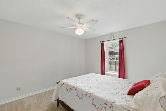 154 Scott Ln, Weatherford, TX 76085 - carpeted bedroom with baseboards and ceiling fan