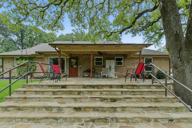 154 Scott Ln, Weatherford, TX 76085 - back of house featuring brick siding, a patio, and stairs