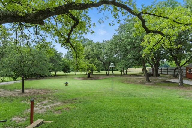 154 Scott Ln, Weatherford, TX 76085 - single story home with brick siding, a front lawn, and a shingled roof