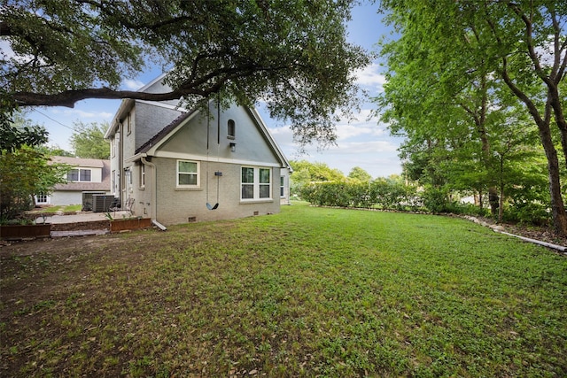 3718 Tulsa Way, Fort Worth, TX 76107 - back of house featuring a yard, central AC, crawl space, and brick siding