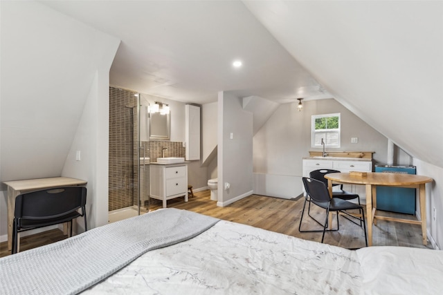 3718 Tulsa Way, Fort Worth, TX 76107 - bedroom featuring wood finished floors, a heating unit, baseboards, vaulted ceiling, and ensuite bathroom