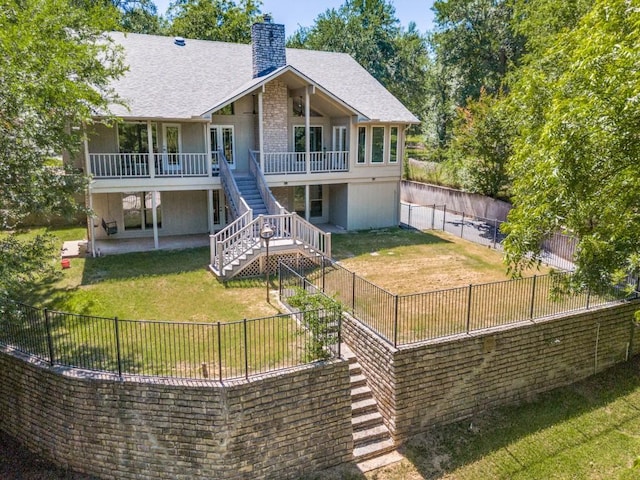 7710 Ravenswood Rd, Granbury, TX 76049 - back of house with a chimney, stairway, a patio, a shingled roof, and a deck