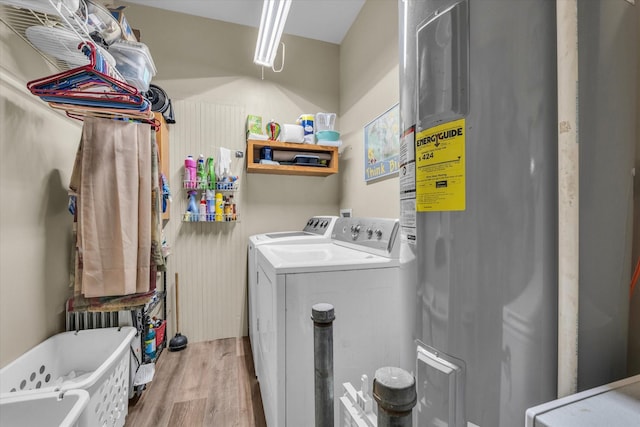 1006 Beaver St, Lacy Lakeview, TX 76705 - laundry area featuring washing machine and clothes dryer, light wood-style flooring, and water heater
