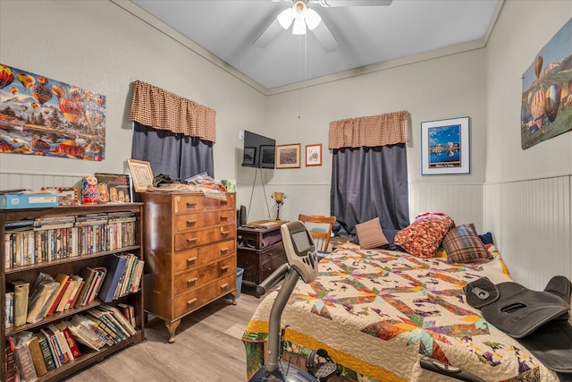 1006 Beaver St, Lacy Lakeview, TX 76705 - bedroom with wood finished floors, wainscoting, and a ceiling fan