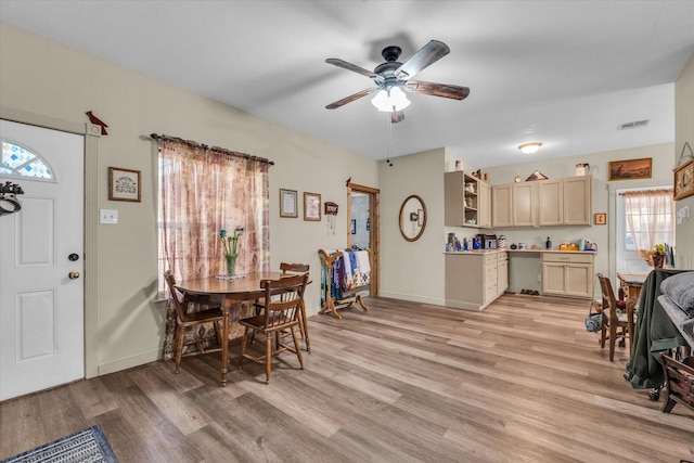 1006 Beaver St, Lacy Lakeview, TX 76705 - dining area with healthy amount of natural light, a ceiling fan, light wood-type flooring, and baseboards