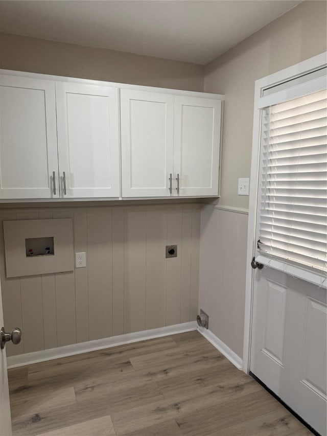 711 S Farmington Rd, Howe, TX 75459 - washroom with hookup for an electric dryer, wood finished floors, a wainscoted wall, cabinet space, and hookup for a washing machine