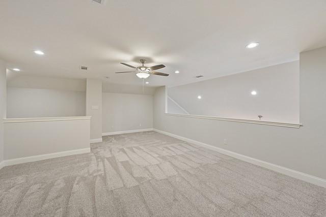 711 Saratoga Dr, Southlake, TX 76092 - empty room featuring ceiling fan, light carpet, recessed lighting, and baseboards