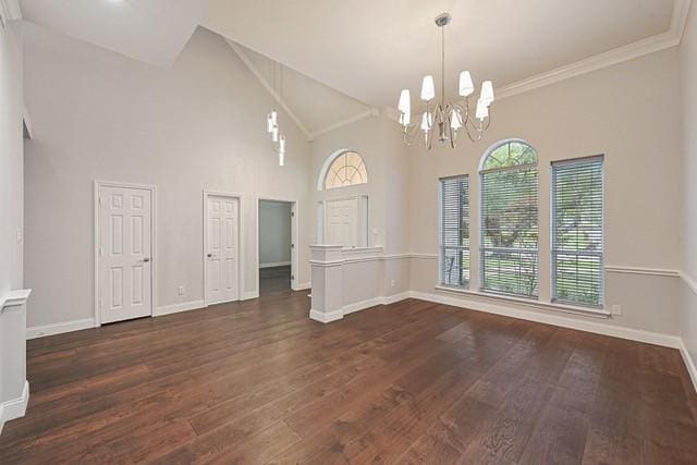 711 Saratoga Dr, Southlake, TX 76092 - unfurnished room featuring a chandelier, dark wood-type flooring, high vaulted ceiling, and baseboards