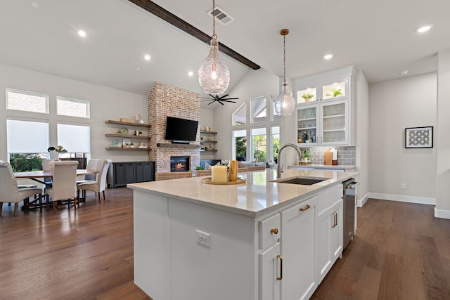 410 Travelers Ter, Argyle, TX 76226 - kitchen with a sink, white cabinets, a brick fireplace, dark wood-type flooring, and recessed lighting
