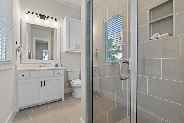410 Travelers Ter, Argyle, TX 76226 - bathroom featuring toilet, vanity, a stall shower, tile patterned flooring, and baseboards