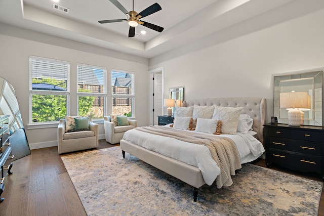 410 Travelers Ter, Argyle, TX 76226 - bedroom featuring a tray ceiling, wood finished floors, baseboards, a ceiling fan, and recessed lighting