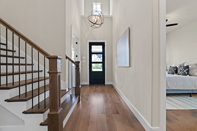 410 Travelers Ter, Argyle, TX 76226 - foyer entrance featuring healthy amount of natural light, wood-type flooring, stairs, and a towering ceiling