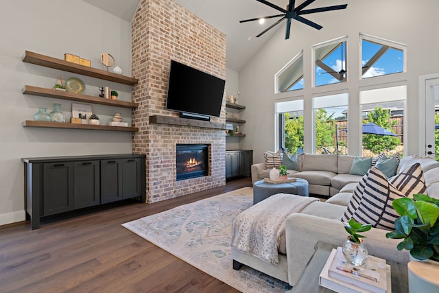 410 Travelers Ter, Argyle, TX 76226 - living room with dark wood-style floors, healthy amount of natural light, a brick fireplace, a towering ceiling, and baseboards