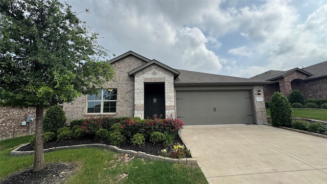 757 High Summit Trl, Fort Worth, TX 76131 - view of front of house with an attached garage, driveway, stone siding, and brick siding