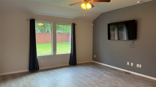 757 High Summit Trl, Fort Worth, TX 76131 - empty room featuring wood finished floors, a ceiling fan, vaulted ceiling, and baseboards