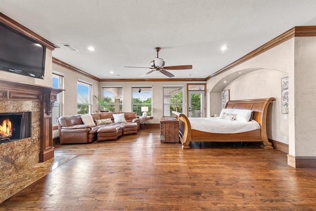 1612 S Lakeshore Dr, Rockwall, TX 75087 - bedroom with crown molding, wood finished floors, a high end fireplace, recessed lighting, and baseboards