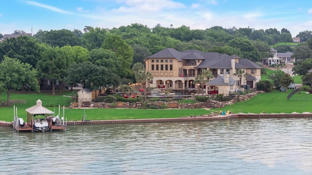 1612 S Lakeshore Dr, Rockwall, TX 75087 - back of property with a water view and a lawn