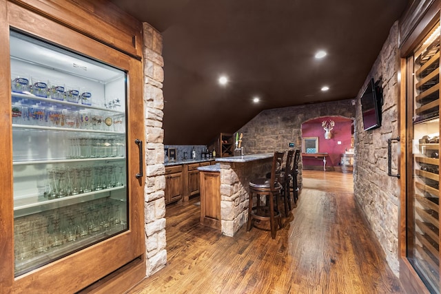 1612 S Lakeshore Dr, Rockwall, TX 75087 - wine cellar featuring dark wood finished floors, bar, recessed lighting, and lofted ceiling