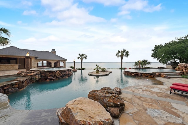 1612 S Lakeshore Dr, Rockwall, TX 75087 - view of swimming pool with a patio, a pool with connected hot tub, and a bar