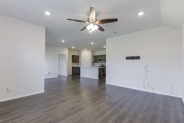 397 War Emblem Ln, Waxahachie, TX 75165 - unfurnished living room with a ceiling fan, baseboards, dark wood finished floors, and recessed lighting