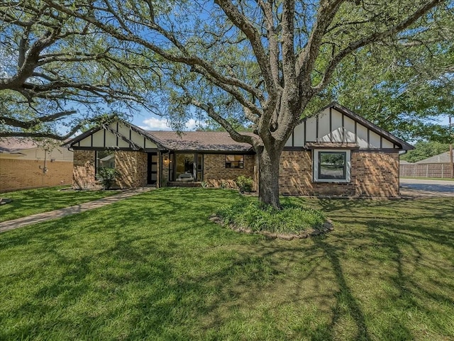 777 NW Charlyne Dr, Burleson, TX 76028 - view of front facade featuring a front lawn and brick siding