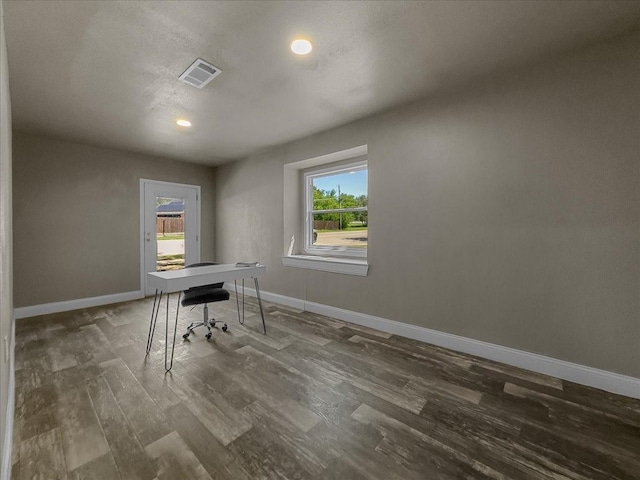 777 NW Charlyne Dr, Burleson, TX 76028 - home office featuring plenty of natural light, wood finished floors, baseboards, and recessed lighting