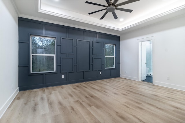 216 Pauline St, Arp, TX 75750 - unfurnished room featuring a raised ceiling, a ceiling fan, baseboards, ornamental molding, and light wood-style floors