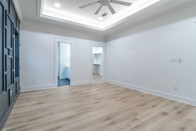 216 Pauline St, Arp, TX 75750 - unfurnished room featuring a raised ceiling, ornamental molding, light wood-style flooring, ceiling fan, and baseboards