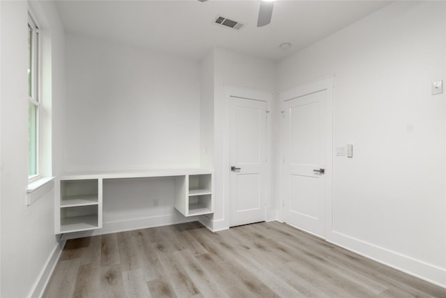 216 Pauline St, Arp, TX 75750 - unfurnished bedroom featuring wood finished floors, baseboards, and a ceiling fan