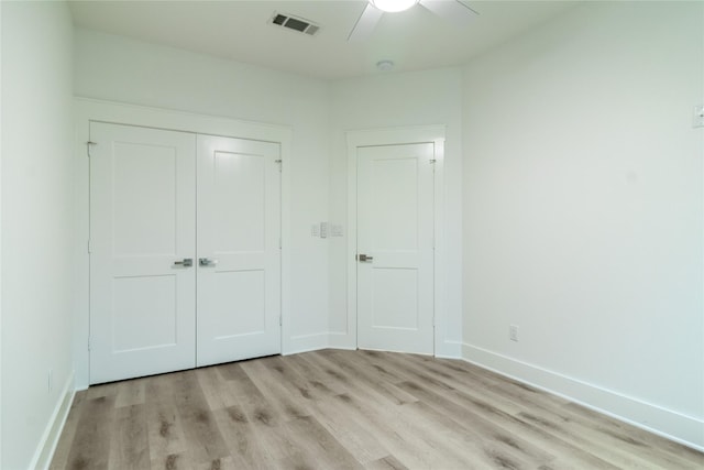 216 Pauline St, Arp, TX 75750 - unfurnished bedroom with light wood-style floors, a closet, and baseboards