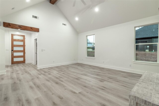 216 Pauline St, Arp, TX 75750 - unfurnished room with high vaulted ceiling, beamed ceiling, baseboards, ceiling fan, and light wood-style floors