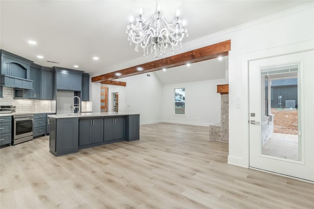 216 Pauline St, Arp, TX 75750 - kitchen with stainless steel electric stove, open floor plan, light countertops, light wood-style flooring, and recessed lighting