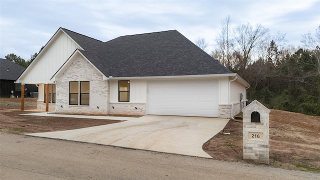 216 Pauline St, Arp, TX 75750 - view of front facade featuring roof with shingles, brick siding, a garage, and driveway