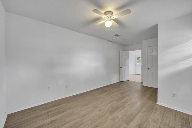 329 Worthy St, Saginaw, TX 76179 - empty room with light wood-type flooring, attic access, baseboards, and a ceiling fan