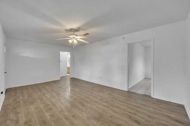 329 Worthy St, Saginaw, TX 76179 - spare room with a ceiling fan, wood finished floors, and baseboards