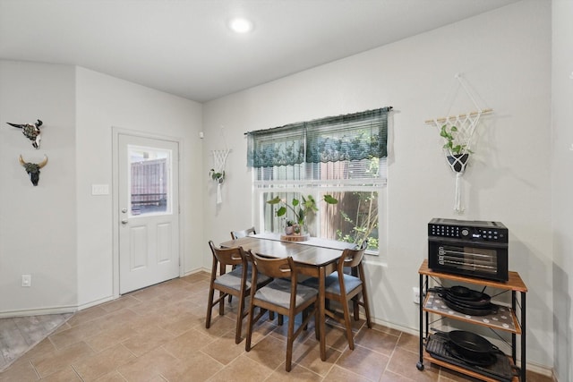 7113 Creighton Ct, Fort Worth, TX 76120 - dining space featuring healthy amount of natural light and baseboards