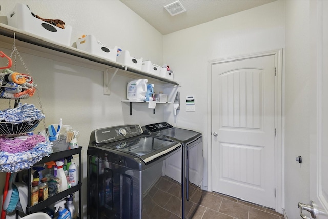 7113 Creighton Ct, Fort Worth, TX 76120 - washroom featuring washer and dryer and dark tile patterned floors