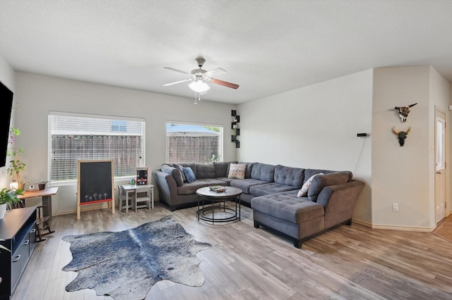7113 Creighton Ct, Fort Worth, TX 76120 - living area featuring ceiling fan, wood finished floors, baseboards, and a textured ceiling