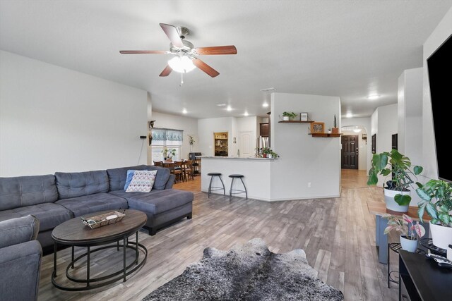 7113 Creighton Ct, Fort Worth, TX 76120 - living room featuring light wood-type flooring and a ceiling fan