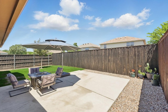 7113 Creighton Ct, Fort Worth, TX 76120 - fenced backyard with a patio and a fire pit