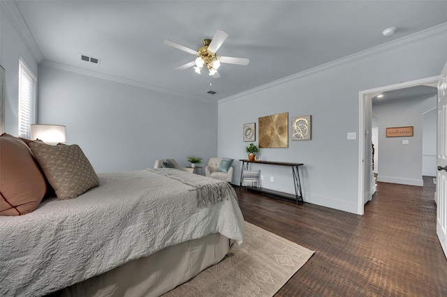 1102 Mccormick St, Garland, TX 75040 - bedroom featuring ornamental molding, wood finished floors, baseboards, and ceiling fan